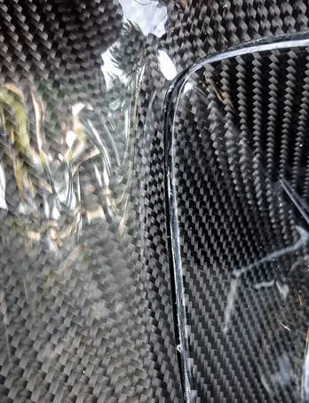 Carbon fiber composite material with epoxy resin system showing detailed weave pattern for advanced applications