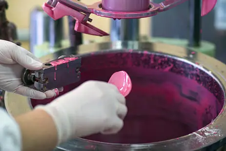 Air-drying 1K epoxy resin application showing purple coating being mixed in industrial container